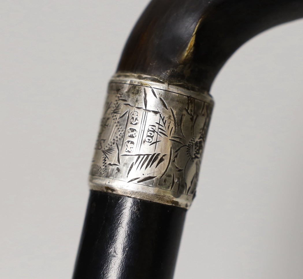 A silver mounted ebony cane with a phallic shaped handle, presented by N.D.T. Chapel to W.H. Miles, 1899. 82cm high